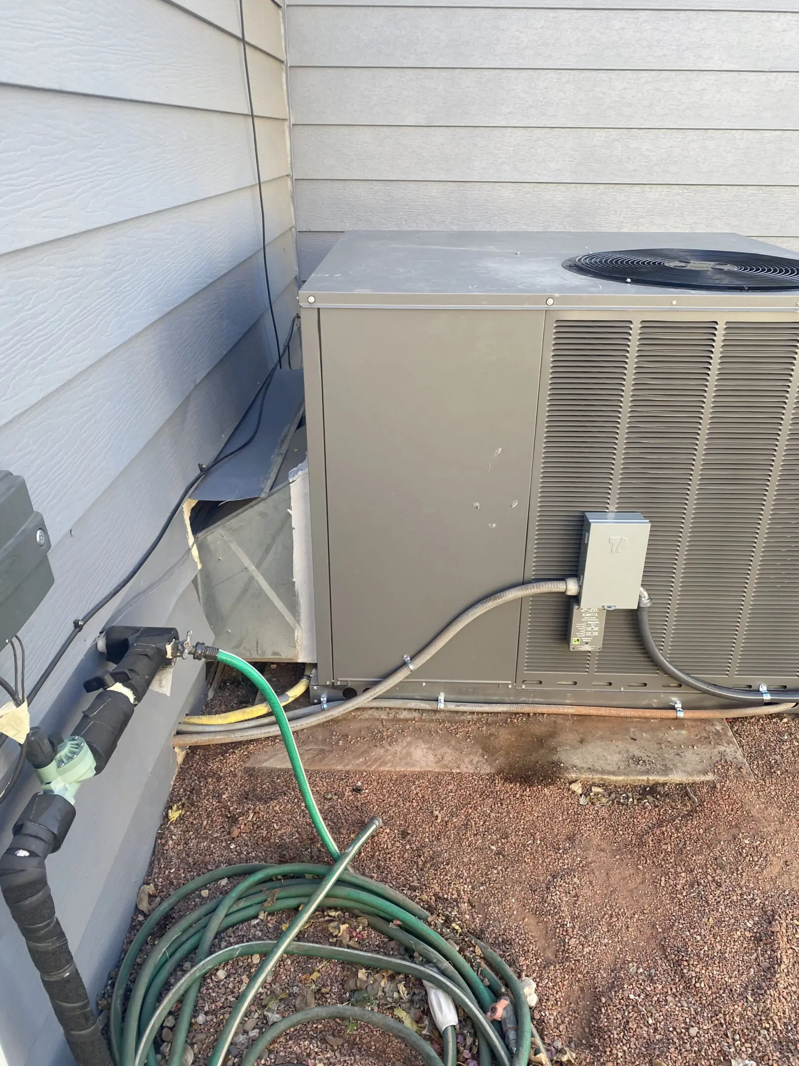 A picture of an air conditioner outside.