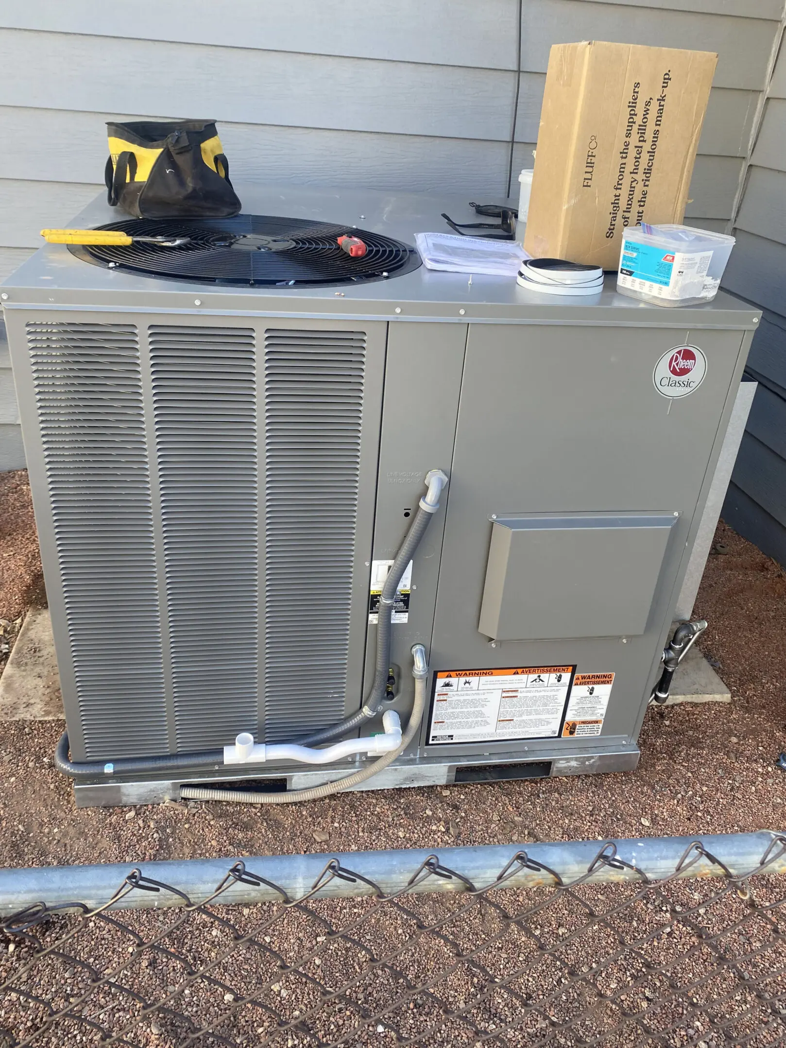 A picture of an air conditioner unit outside.