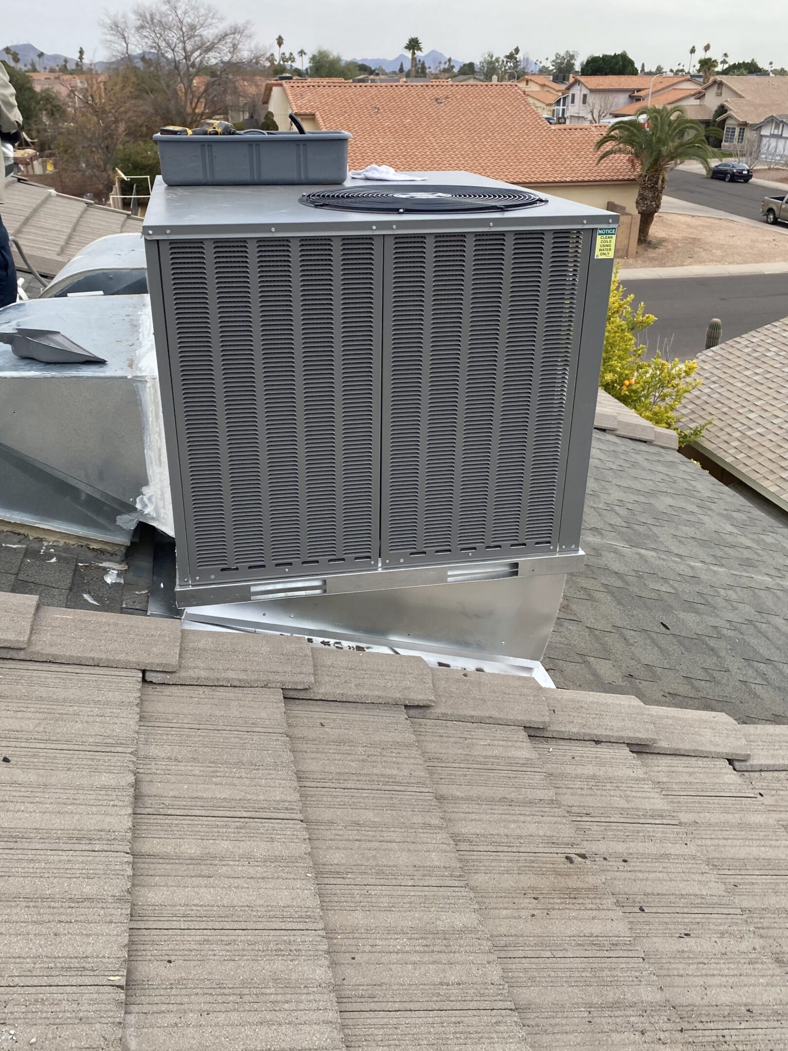 A close up of an air conditioner on the side of a house