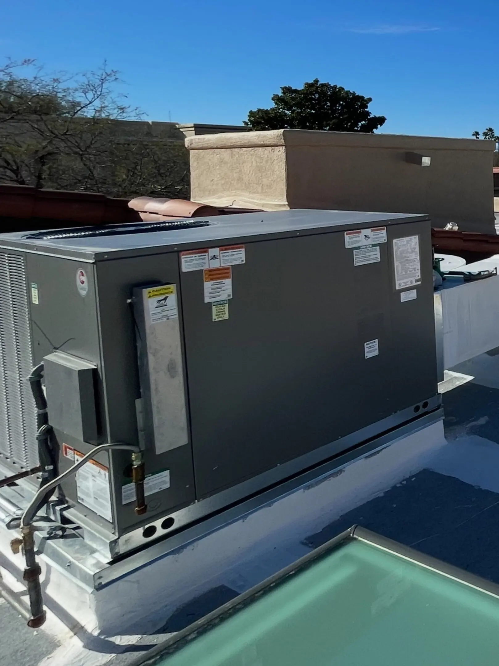 A large air conditioner on top of a building.