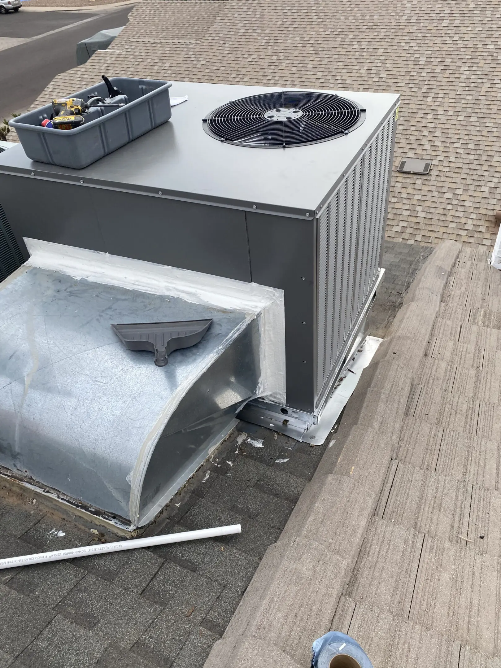 A large air conditioner that is on the ground.