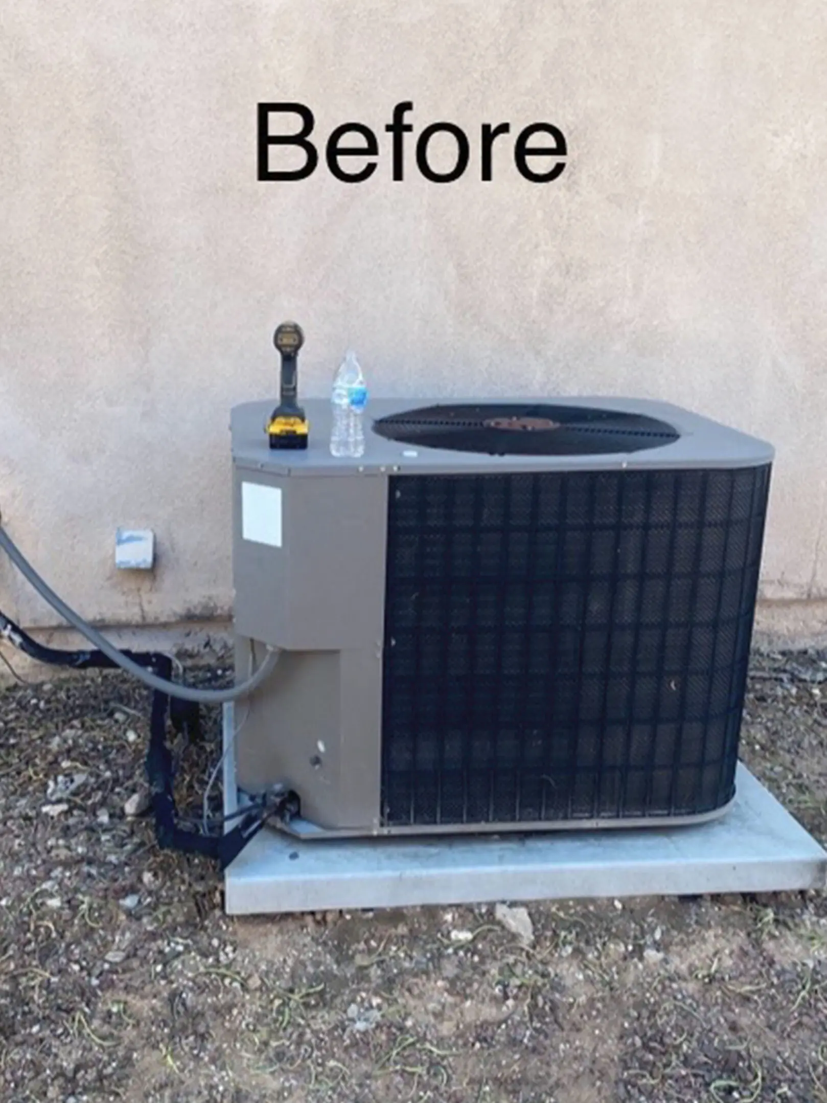 A picture of an air conditioner that is being cleaned.